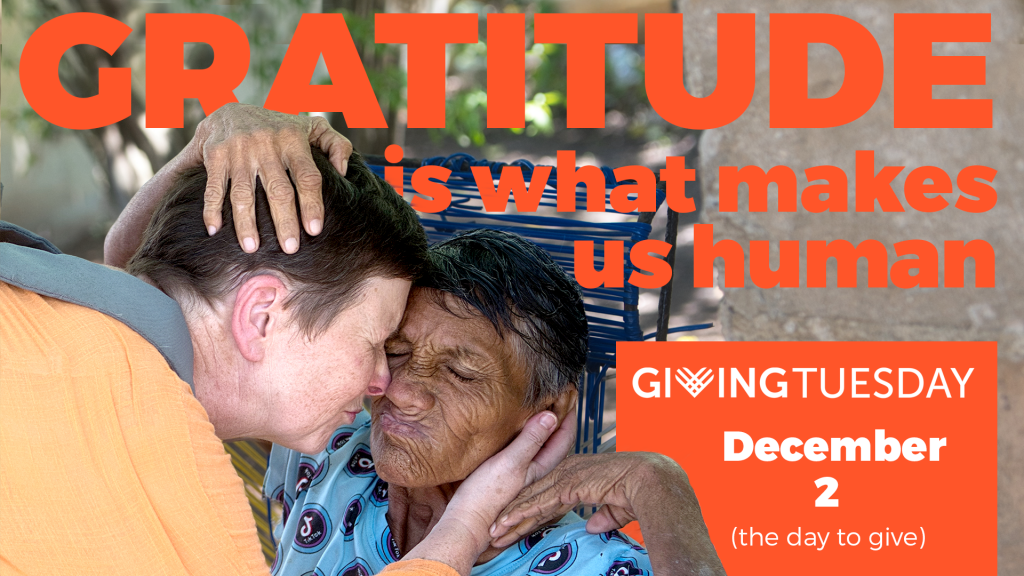 Alex Fisher and a patient share an embrace.